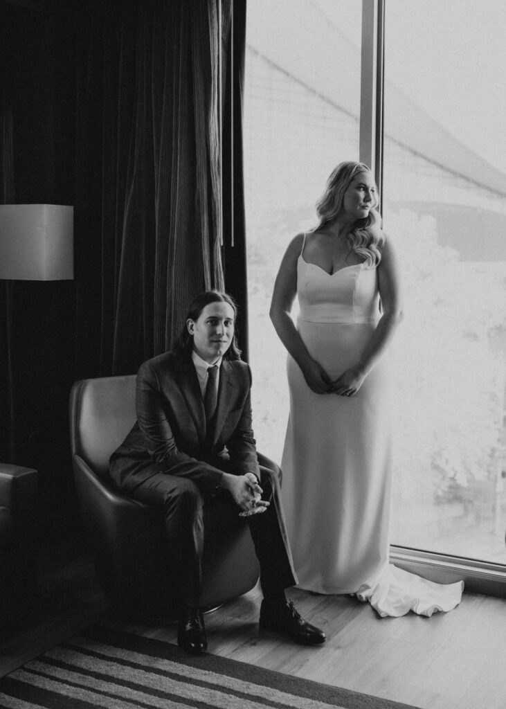 A couple is captured in a black-and-white photo