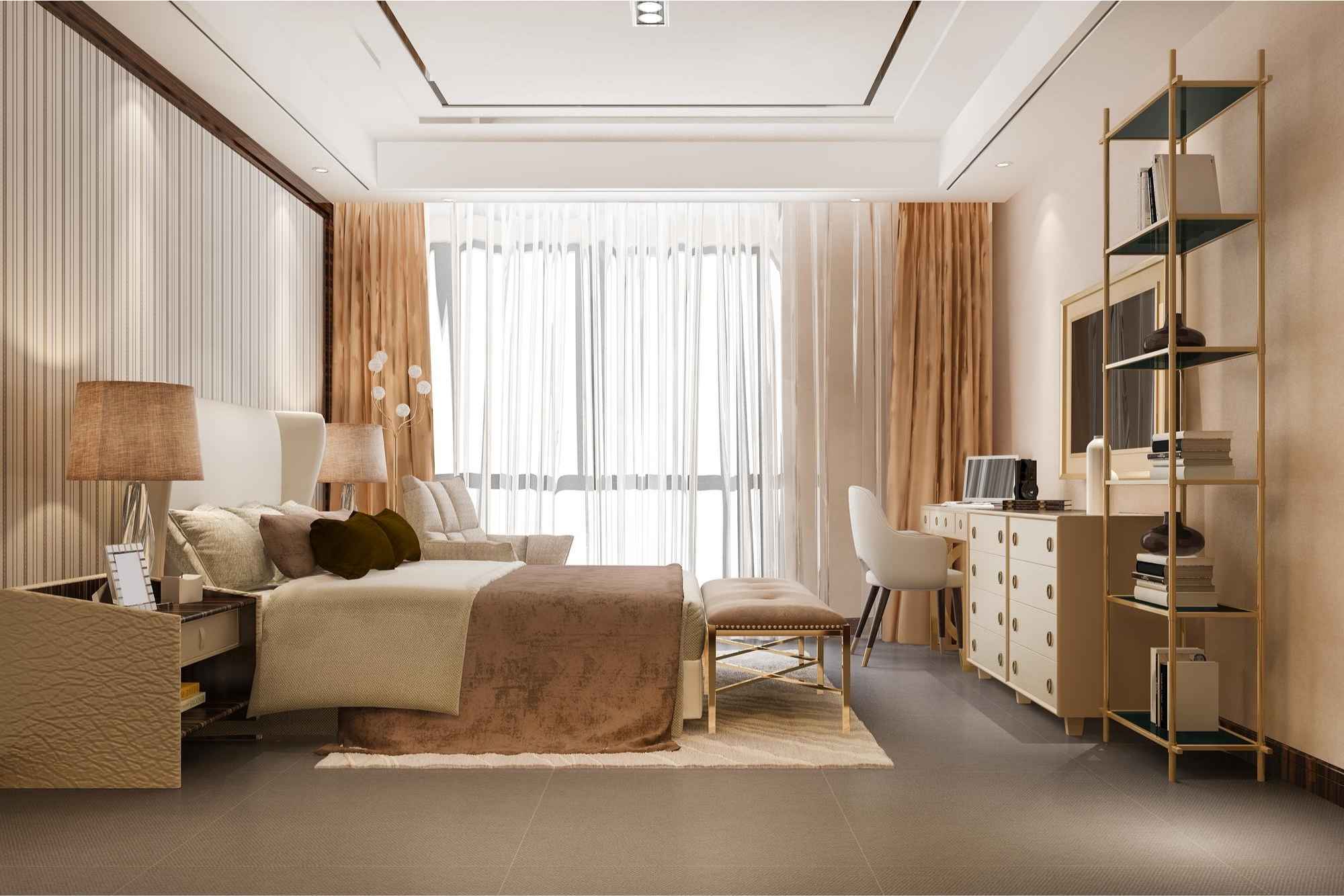 A stylish bedroom features a bed with beige and brown bedding