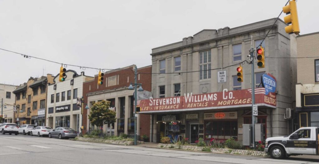 A street corner with a gray building